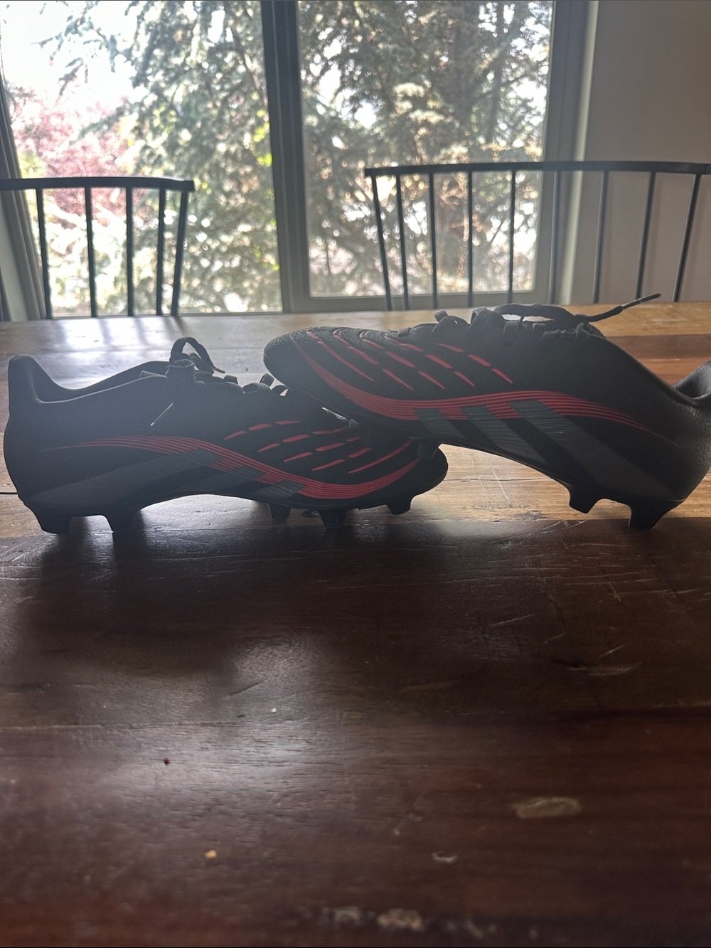 adidas Men's Black Soccer Cleats with Red Stripe Accents